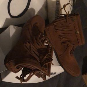 Dark brown suede moccasins.